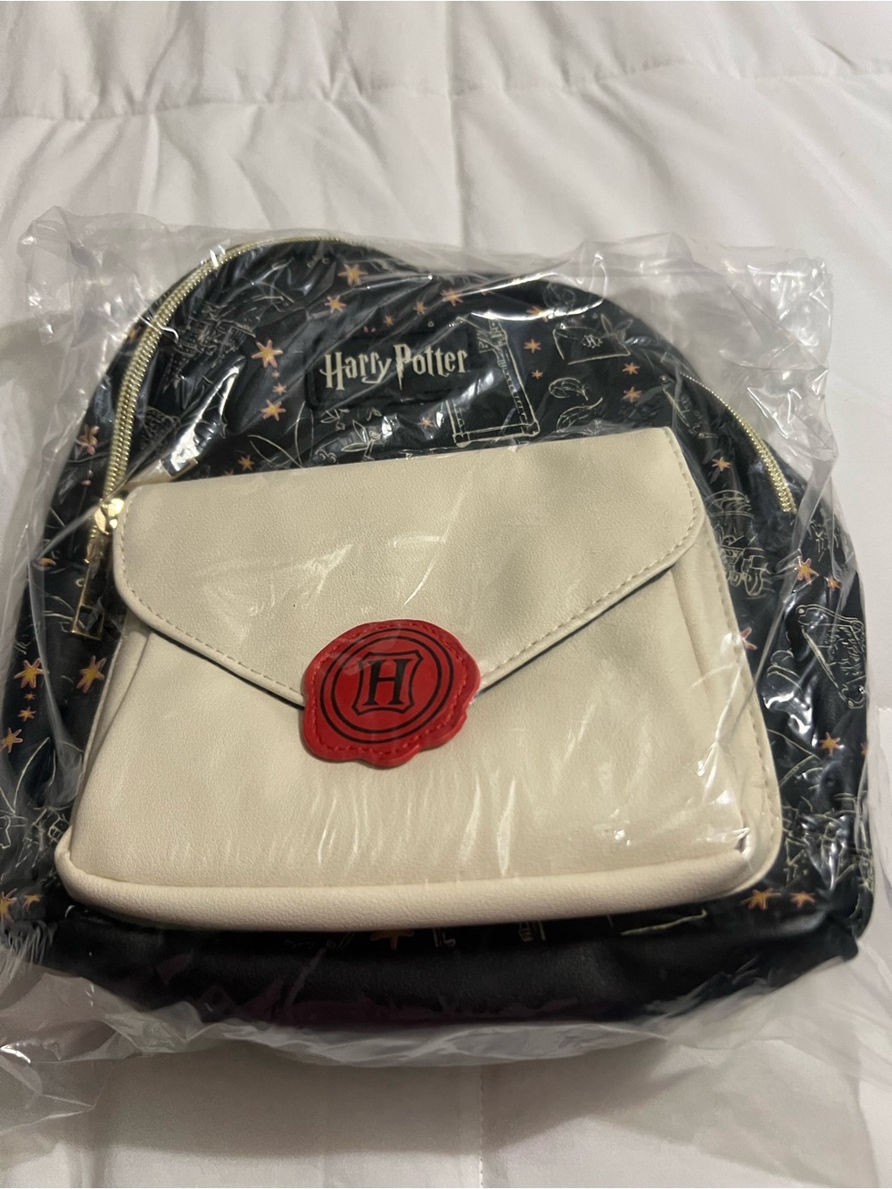 Warner Bros. Harry Potter Black Backpack with Cream Front and Red Seal